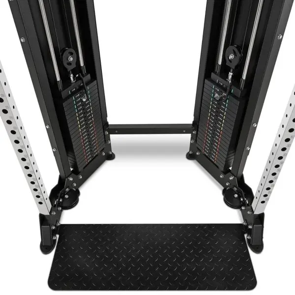 Close-up view of a dual adjustable pulley gym machine with weight stacks and a footplate. The metal frame has multiple adjustment holes and cable pulleys on each side, set against a white background.