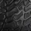 Close-up of the rugged ATX® Slam Ball, featuring a black textured surface with deep grooves and angular raised patterns designed for optimal grip.