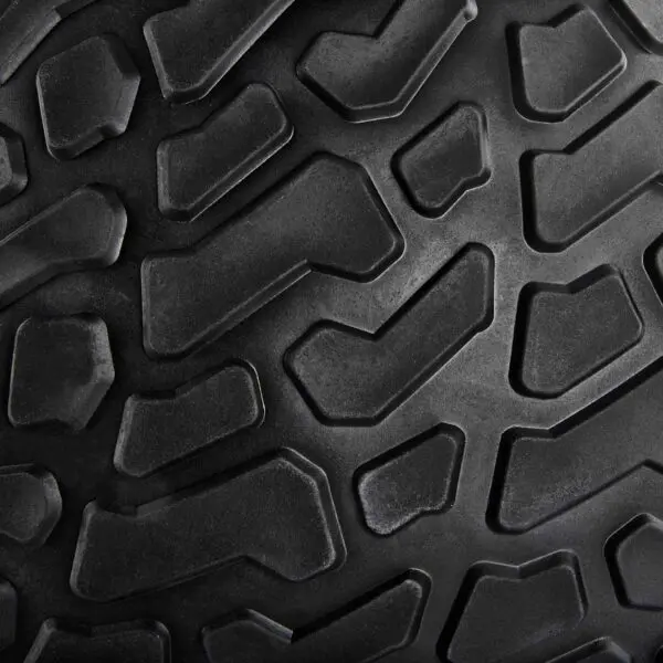 Close-up of the rugged ATX® Slam Ball, featuring a black textured surface with deep grooves and angular raised patterns designed for optimal grip.