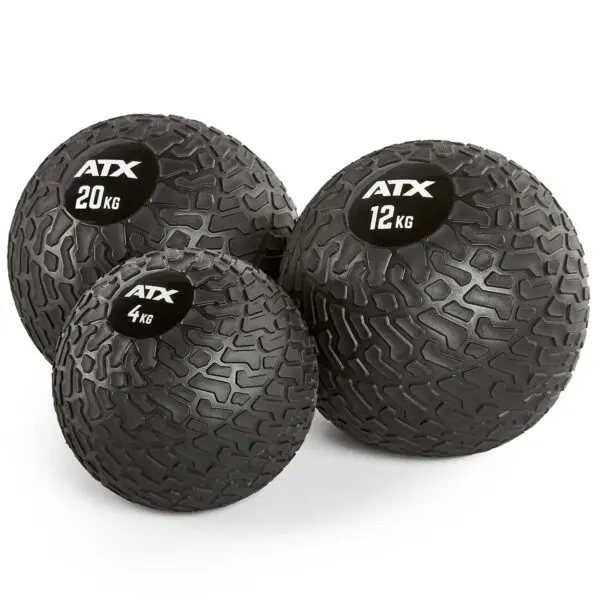 Three black ATX® Slam Balls, featuring white logos and weights of 4 kg, 12 kg, and 20 kg from left to right, with a textured pattern for enhanced grip.