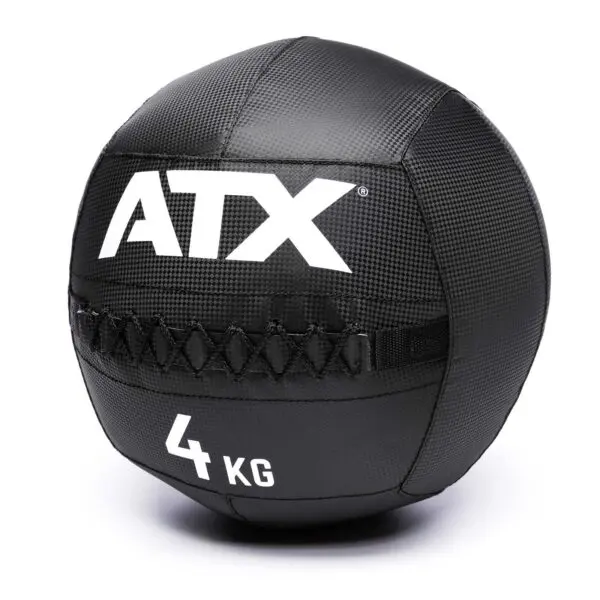 A black ATX® Wall Balls PVC, featuring 4 KG in white, a textured surface, and reinforced stitching.