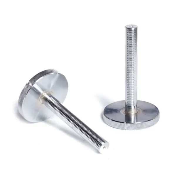 Close-up of two silver metal knobs with long threaded stems on a white background, reminiscent of Ironmaster Quick-Lock Add On Kit. One knob stands upright, the other lies on its side, highlighting the ridged texture and flat circular base.