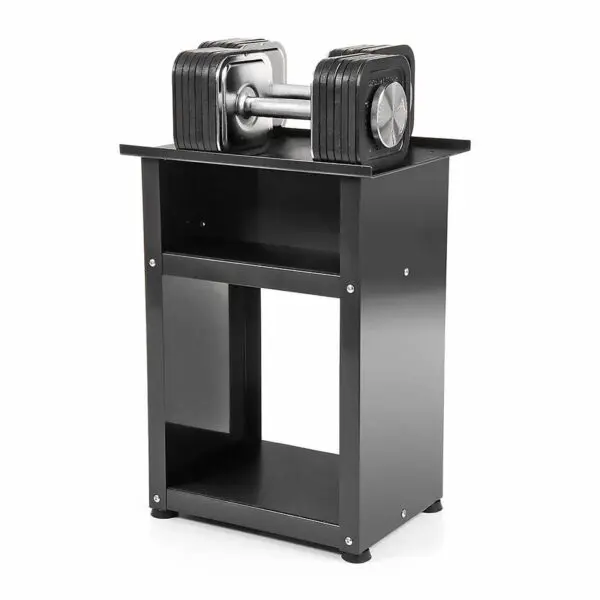 A pair of Ironmaster Quick-Lock Adjustable Dumbbells rests on a sleek black open-shelf stand. With visible weight markings and a modern design, they combine style and functionality. The minimalistic, sturdy rectangular stand is ideal for efficient home gym storage.