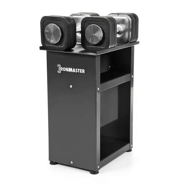 A set of Ironmaster Quick-Lock Adjustable Dumbbells rests on a sleek, modern black stand with visible weight markings. This sturdy, compact stand has two shelves for storage, perfect for organized fitness enthusiasts.