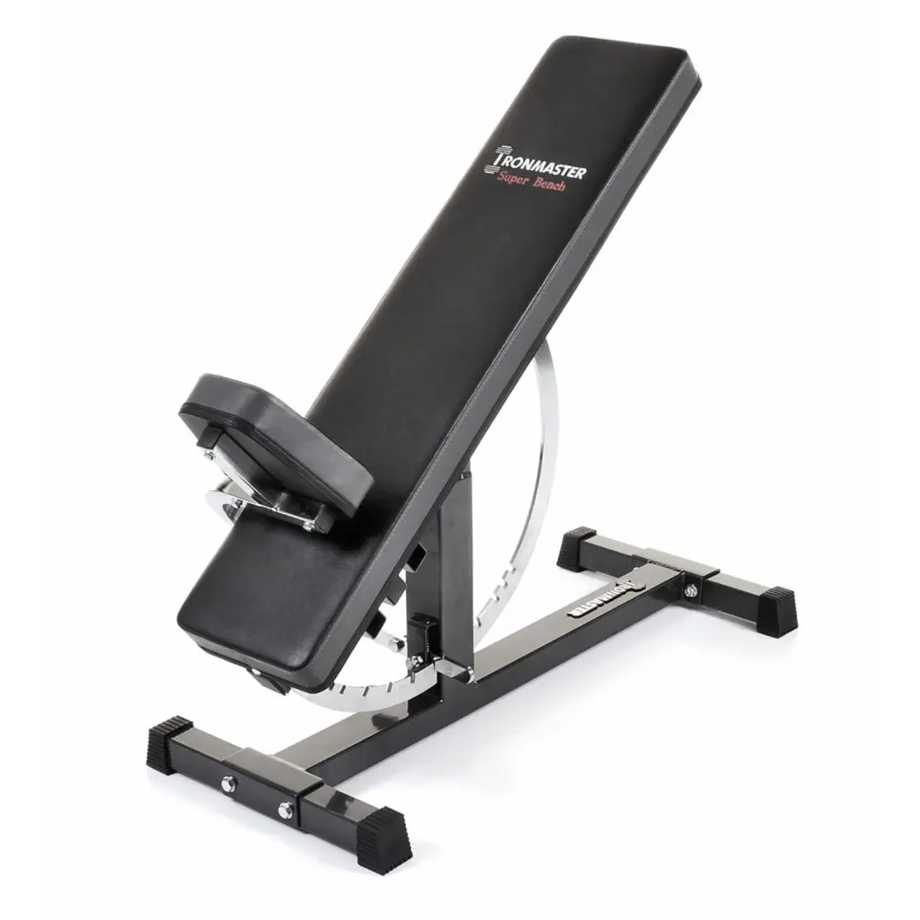 Featuring black padding and a sturdy metal frame, the Ironmaster Super Weights Bench includes an attached seat and incline-capable backrest. Rubber foot caps ensure stability, while its brand logo is prominently displayed on the backrest.