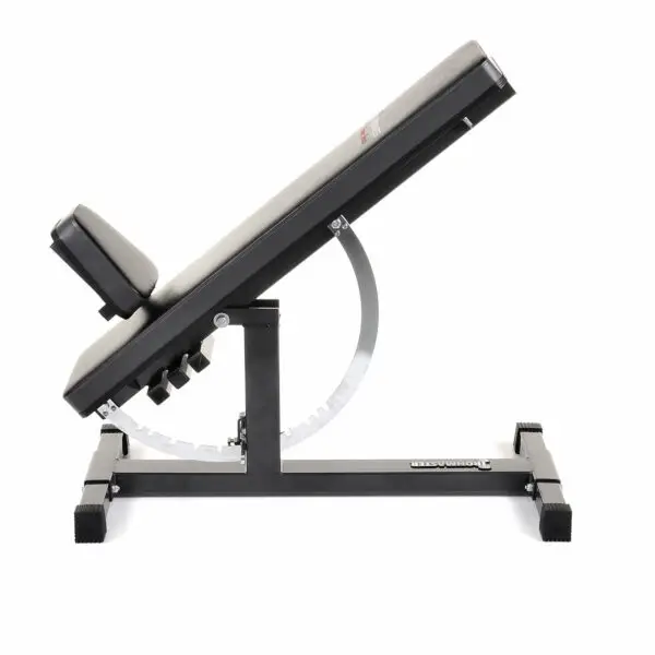 The Ironmaster Super Weights Bench features an adjustable workout bench in a declined position, with a padded backrest and seat. Its robust metallic finish frame offers a gear mechanism for precise angle adjustments, making it perfect for strength training.