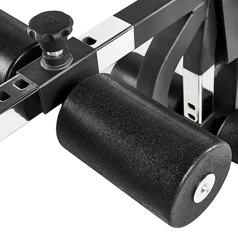 Close-up of a black foam roller attachment on the ATX Leg Extension Leg Curl Machine, highlighting an adjustment knob on the side. The shiny, chrome-like metal enhances the sleek, modern design of this fitness equipment.