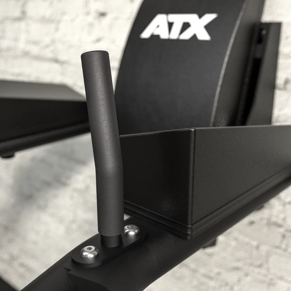 Close-up of a black metal handle attached to the ATX® Wall Mounted Knee Raise & Dip, featuring ATX branding, and positioned against a white brick wall background.