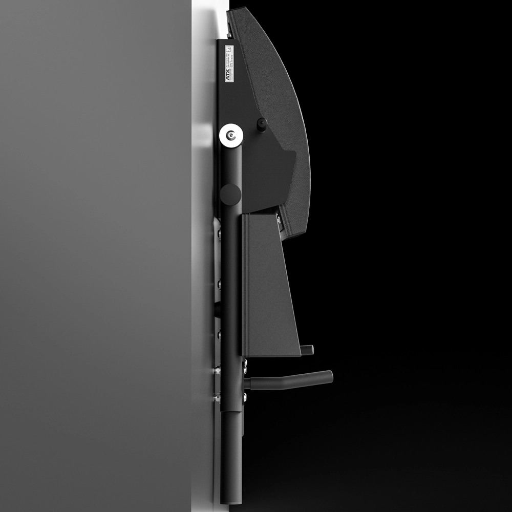 Side view of the ATX® Wall Mounted Knee Raise & Dip—a black, modern wall-mounted folding bench or seat attached to a gray wall—ideal as a knee raise station—shown in the upright, stowed position against a black background.