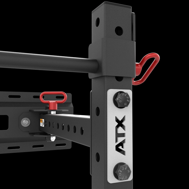 Close-up of the ATX® Fold Back Rack - Wall Mounted in black and silver, featuring red safety pins, adjustment holes, sturdy steel build, and clear branding against a black background.