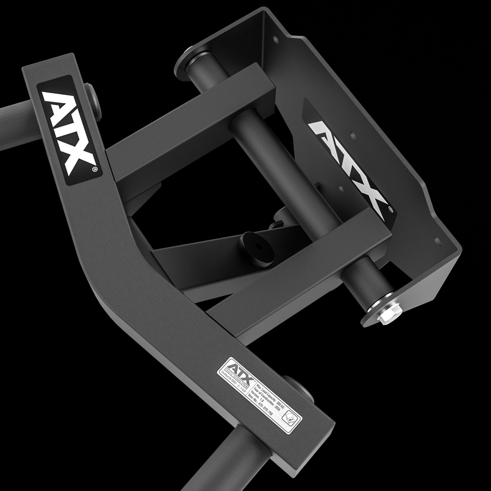 Close-up of a black ATX® Folding Wall Mounted Dip Handles gym equipment part, highlighting its sturdy metal frame, bolts, and a label with specifications, set against a black background.