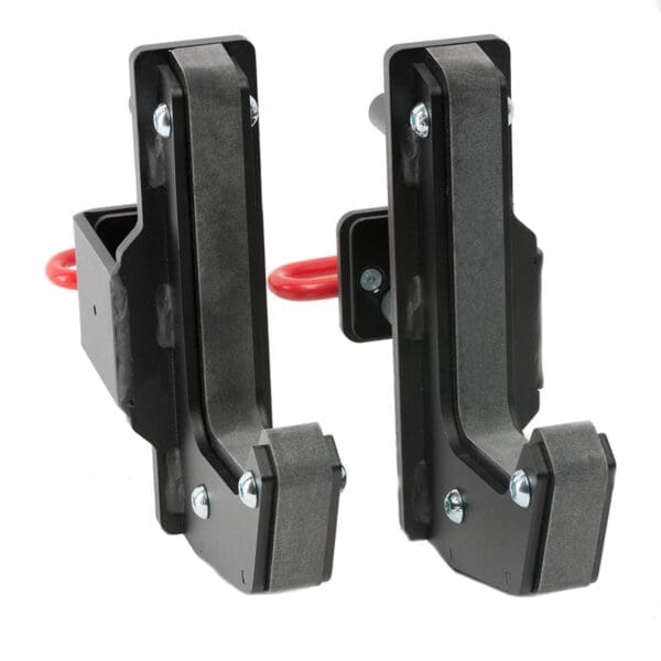 The ATX® J-Hooks Type III feature a black metal design for power racks, red safety pins, and padded interiors to protect barbells. The upright position highlights their robust and solid construction.