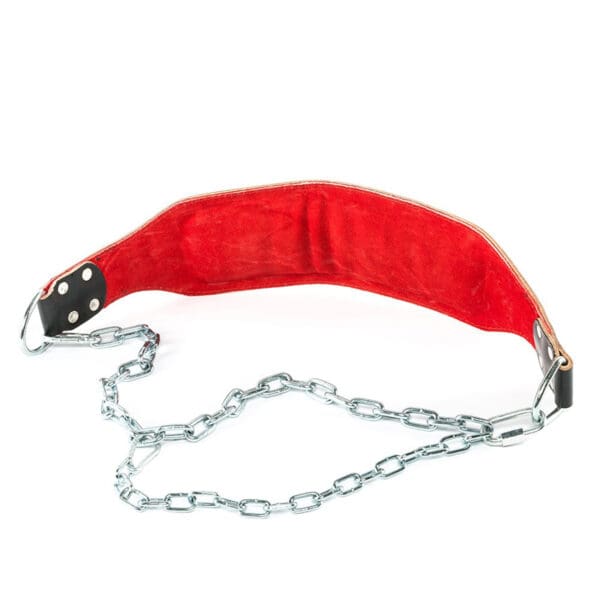 The ATX® Leather Dip Belt, in red, features a padded fabric panel and metal chain for adding weight to your exercises. Its durable leather construction enhances your workout regimen seamlessly.