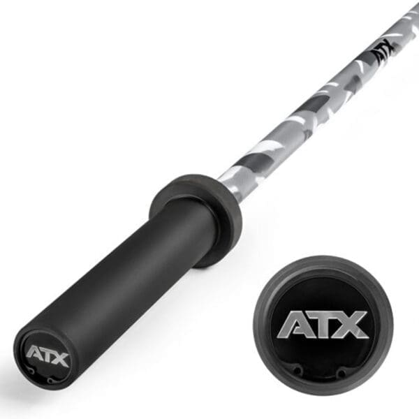 The ATX® Olympic 150cm Barbell Camo features a camo design and black end caps with ATX lettering. Displayed from a slightly angled top-down view, the barbell includes an inset circle highlighting the logo.