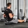 A person in a black shirt and gray shorts is sitting on the ATX® Seated Row Seat in a gym, pulling the cable toward their torso for a workout, with various gym equipment visible in the background.