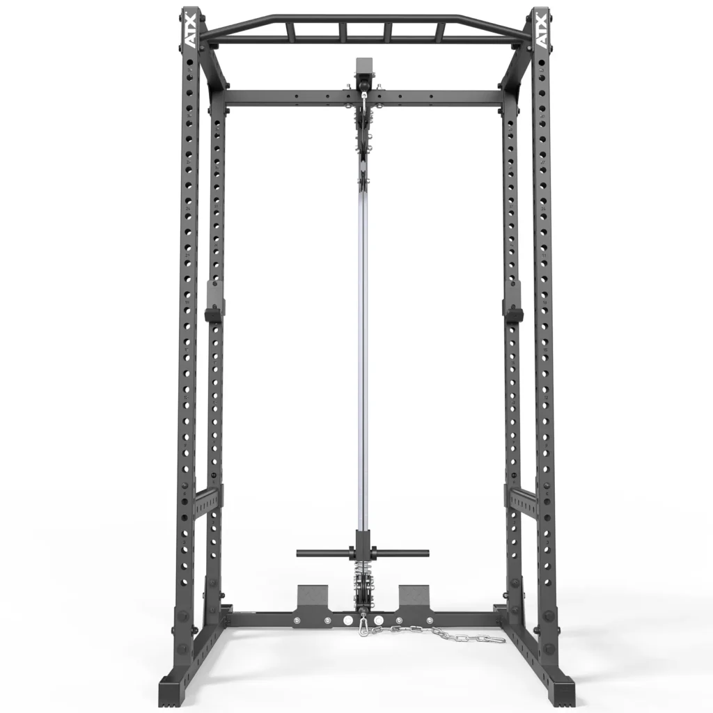 The ATX® Power Rack 520 215cm System Plate Loaded includes a barbell and attachment, adjustable spotting arms, multiple height settings, a metal structure with a pull-up bar on top, designed for weightlifting and strength training.