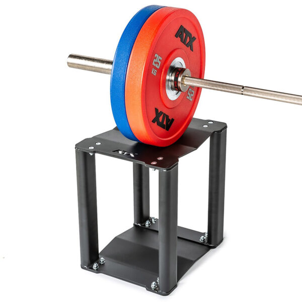A heavy-duty squat barbell with red and blue weight plates rests on the sturdy ATX® 3 in 1 Pulling Blocks metal stand. The black frame contrasts elegantly with the white floor, showcasing the equipments professional design and robust construction.