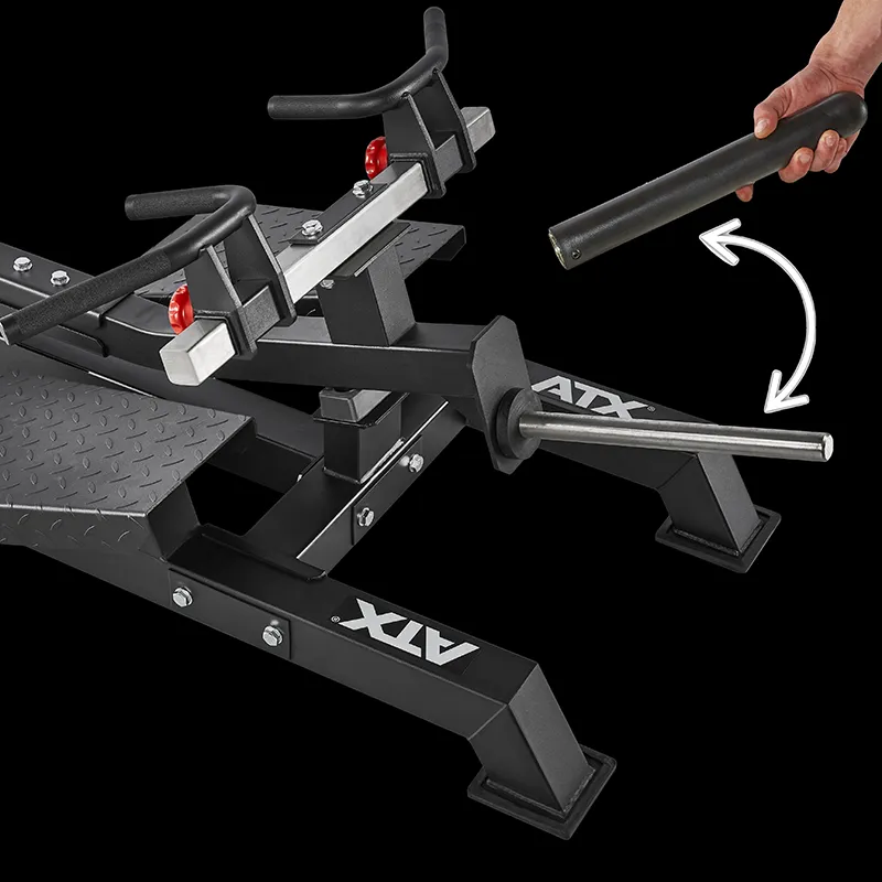 A close-up of the ATX® T-Bar Row Machine shows a hand holding a removable cylindrical attachment next to the bar, demonstrating how the attachment fits onto the equipment.