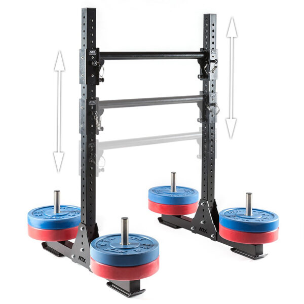 The ATX® Bulls Strongman Yoke, now discontinued, features a black and metallic frame with adjustable height. Blue and red weight plates are stacked on supports at the base, with weights in each corner. Arrows highlight the height adjustment feature.