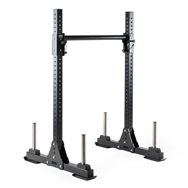 The black ATX® Bulls Strongman Yoke, now discontinued, is a heavy-duty gym squat rack with adjustable hooks and safety bars. It features four weight storage rods at the base, making this freestanding rack minimal yet solid for home or commercial use.