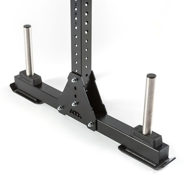 The discontinued ATX® Bulls Strongman Yoke is a black metal sled attachment with two vertical steel posts for weight plates, multiple height-adjustment holes, and the ATX brand on the central bracket all set against a white background.