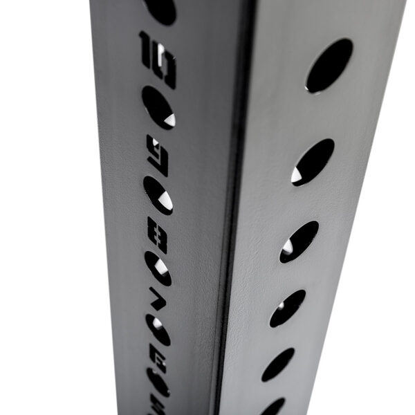 Close-up of the ATX® Bulls Strongman Yoke DISCONTINUED, showcasing a vertical metallic pole with evenly spaced circular holes, shadows, and etched numbers, suggesting structural support or modular design.