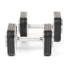 A pair of Ironmaster 45lb Adjustable Dumbbells with black plates and silver handles are placed side by side on a white background, each featuring five weight plates per side, highlighting their modern and sleek design.