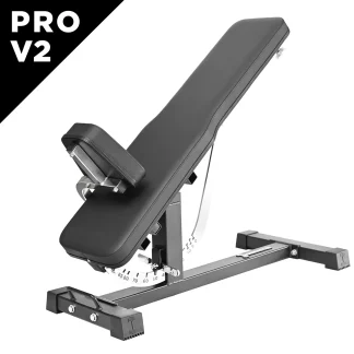 Ironmaster Super Bench PRO V2 features black padding, an angled backrest, and a sturdy metal frame. The “Super Bench PRO V2” branding is visible in the top left corner. The bench is set to an inclined position with adjustment markings displayed on the side.