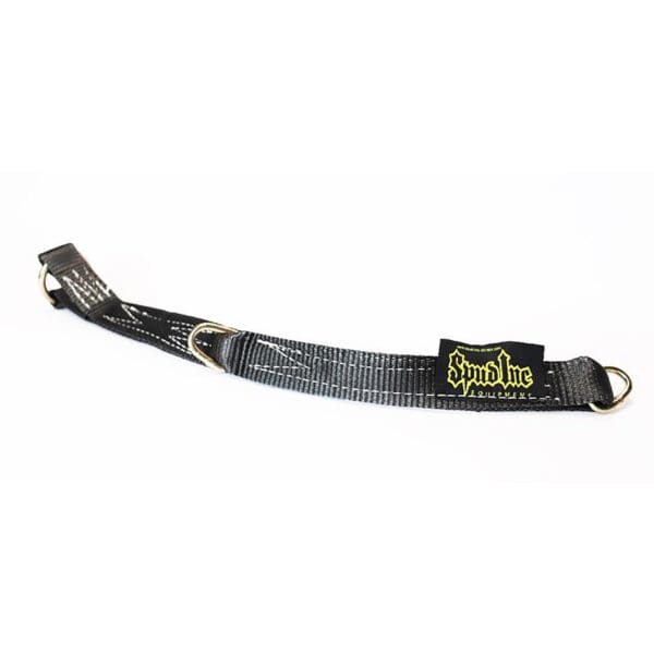 The Spud Inc Adjustable Loading Strap is a black and gray belt with a yellow logo patch, featuring metal loops on each end, laid flat on a white background.