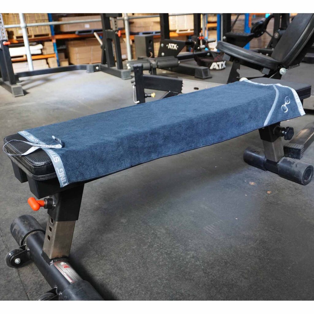 Sting Gym Towel on a flat bench