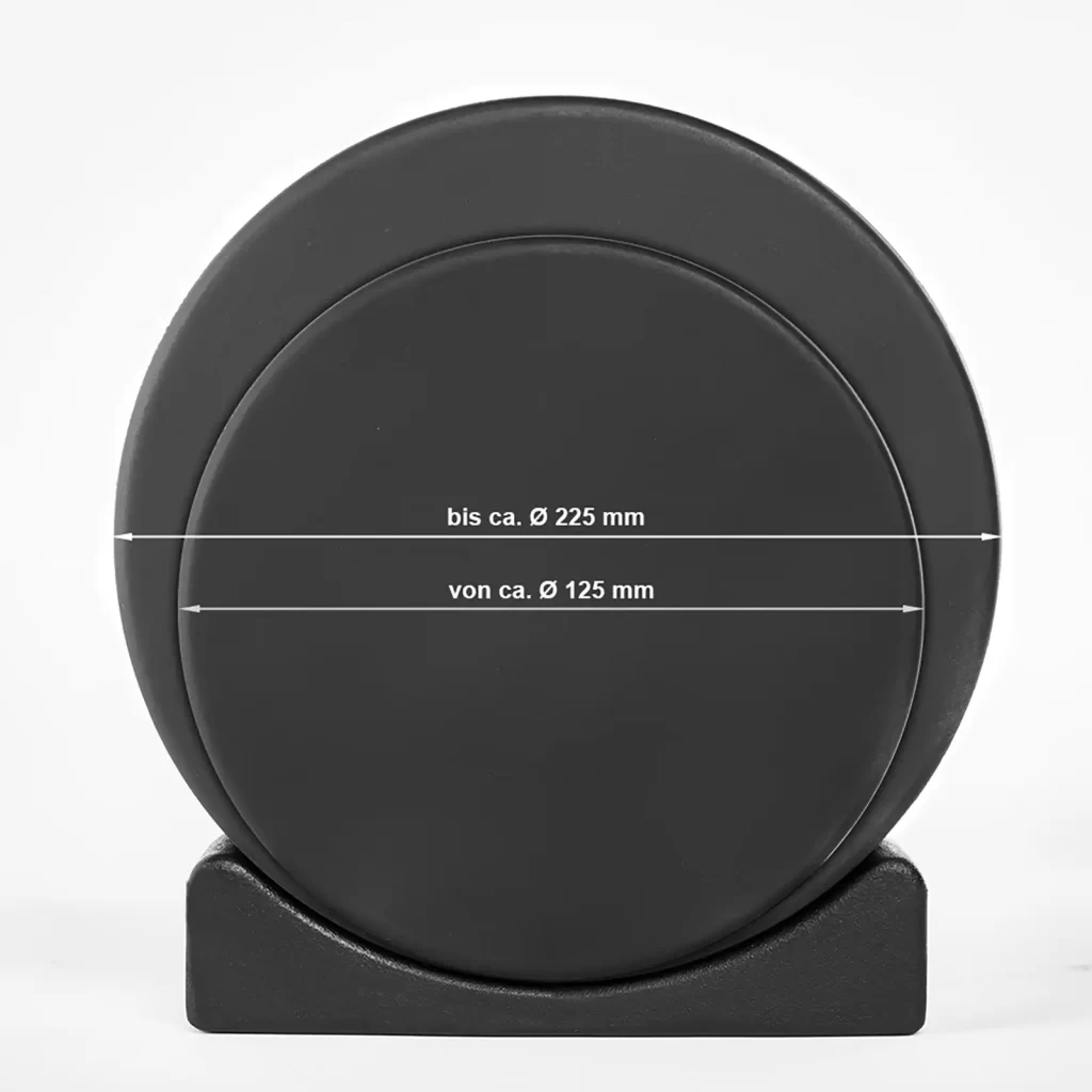 A black circular Dumbbell Saddle with surface measurements: bis ca. Ø 225 mm and von ca. Ø 125 mm, supported on a black base against a white background.
