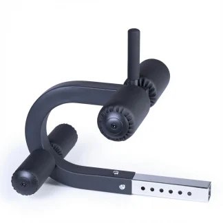The Ironmaster Crunch Attachment is a black adjustable gym equipment accessory featuring padded rollers and a metal insert bar, designed to securely hold your legs during exercises such as sit-ups or leg curls. The product is shown against a white background.