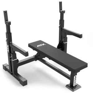 The ATX® Olympic Bench Press 700 is a black weight bench with adjustable barbell holders, boasting a sturdy frame, multiple height adjustments, and safety catches. Ideal for strength training exercises like bench pressing.