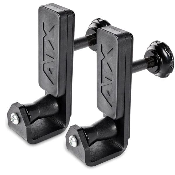 Two ATX® Roller J-Hooks Universal, black clamp-style exercise barbell holders, featuring adjustable knobs and an embossed ATX logo. They have a sturdy rectangular design with a screw for attachment.