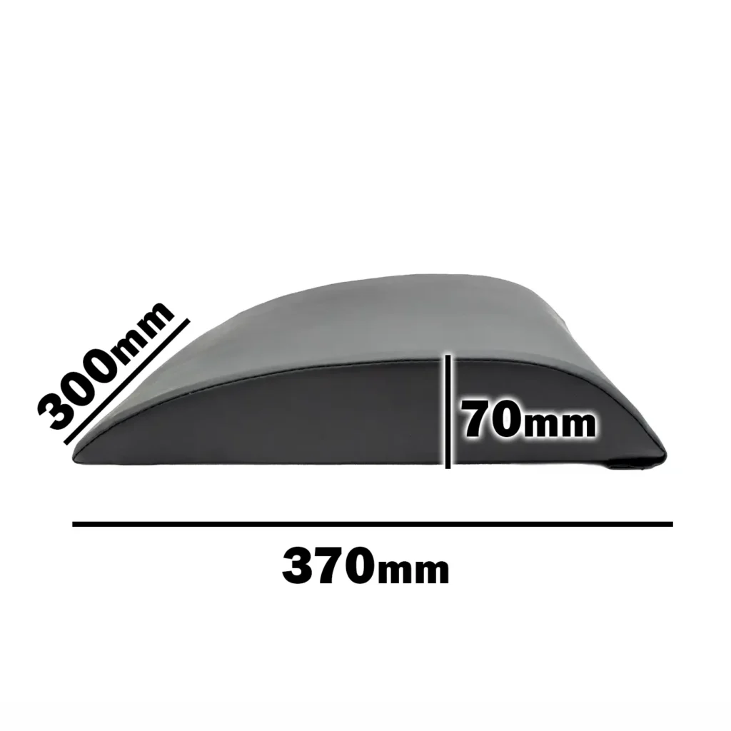 The Perfect AB Pad is a black wedge-shaped ab crunch pad measuring 300mm in height, 70mm in width, and 370mm in length. Its smooth surface offers support and comfort to enhance your workout experience.