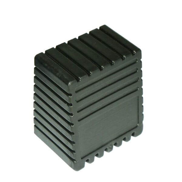 The Rubber Foot 50mmx50mm is a black, rectangular plastic object with ribbed edges, featuring a grooved design that resembles a heat sink or protective casing.