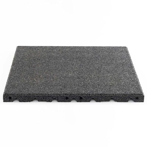 The Shock & Sound Tile 30mm System is a gray rectangular foam or rubber mat with a textured, flat top and uneven edge, set against a white background. It features grooved patterns on the bottom edge for potential cushioning or anti-slip benefits.