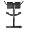 The ATX® Hyperextension Machine 650 is a black back extension bench with padded support, designed for back exercises. It features adjustable settings and sturdy handles, making it suitable for use in both home and gym environments.