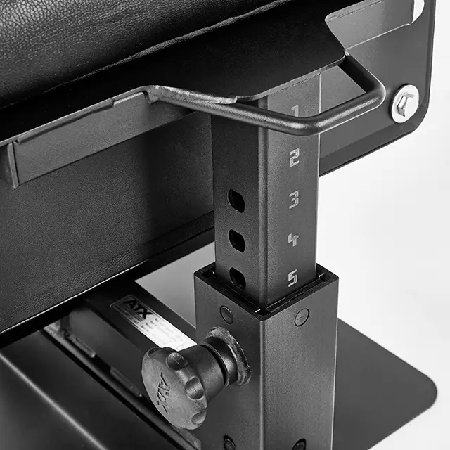 A close-up of the adjustable mechanism on the ATX® Sissy Squat Stand shows a metal bracket with numbered holes 1 to 5, a protruding hook, and a tightening knob against a black cushioned background.