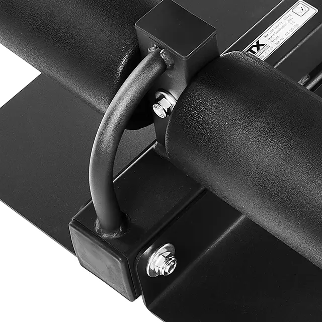 Close-up of the ATX® Sissy Squat Stand featuring a black finish, curved handle, and two cylindrical parts connected by screws on a sturdy metal frame. Ideal for rigorous workouts, it displays high-quality craftsmanship with a label partially visible.