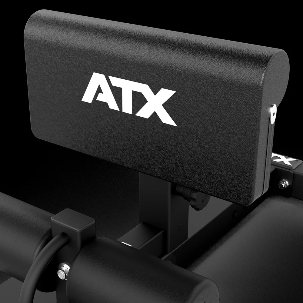 An ATX® Sissy Squat Machine featuring a black frame and a padded calf support cushion with a white logo.