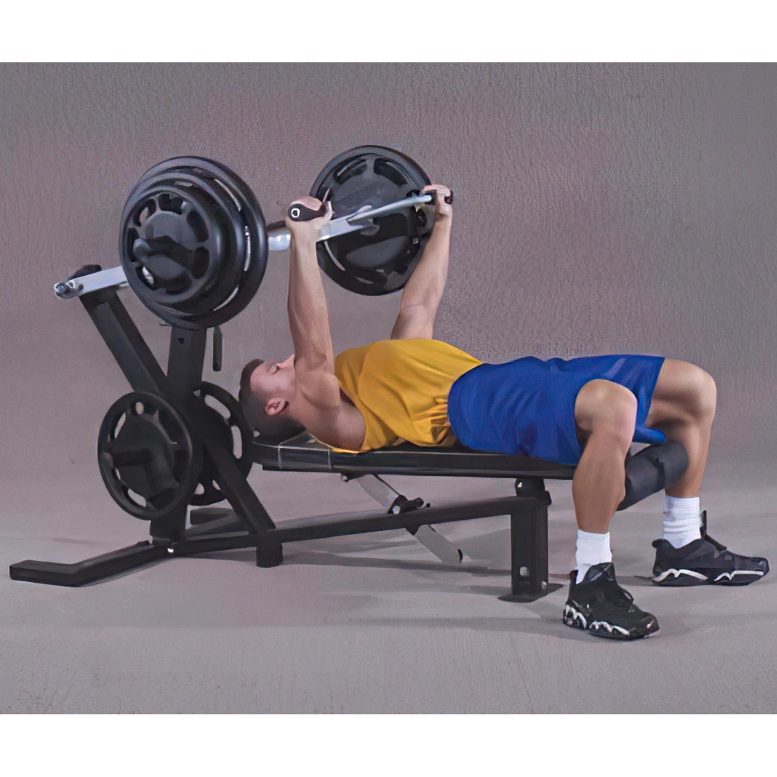 Powertec Leverage Chest Press with a man doing a leverage bench press