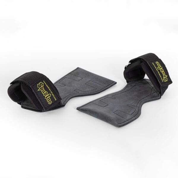The Spud Inc The Gripazz are black wrist straps with yellow stitching, designed for weightlifting. They feature a padded section and a hook-and-loop closure to secure around the wrists, displayed on a white background.