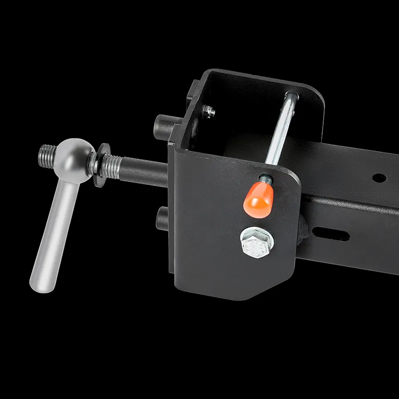 A close-up of the ATX® Belt Squat Option features a black metal hitch mount with a silver handle, bolt, and orange safety pin against a solid black background.