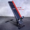 The Ironmaster Head Extension SB is an adjustable workout bench featuring a black padded surface, a sturdy metal frame, and a backrest angled at 41 inches (104.1 cm), placed on a textured floor against a plain backdrop.