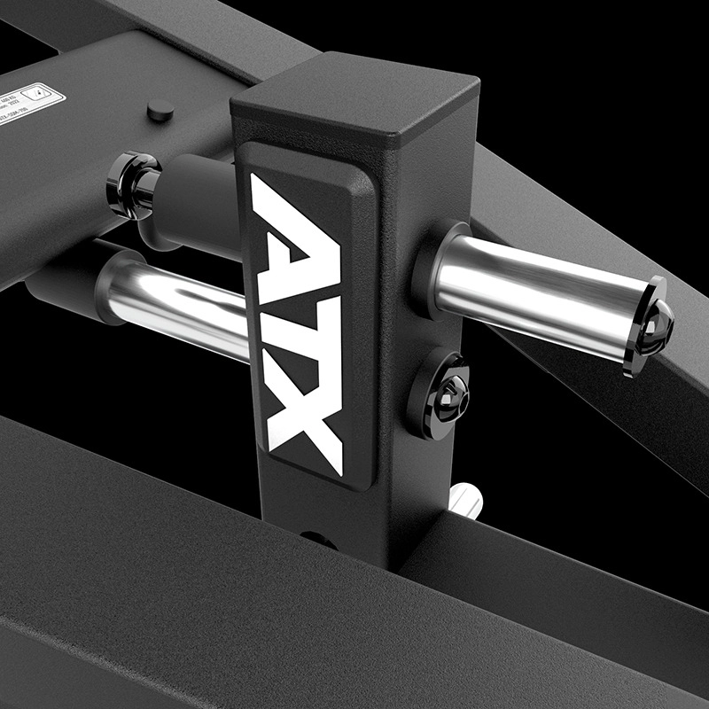 Close-up of a black metal ATX® Lever Arm Squat Pro - Viking Press part with white ATX letters, featuring shiny chrome rods and bolts against a black background.