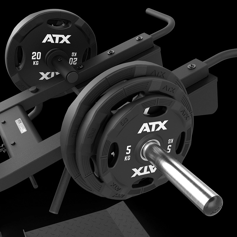 Close-up of the ATX® Lever Arm Squat Pro - Viking Press loaded with black ATX 20 kg and 5 kg weight plates on a silver barbell, all set against a black background with a strong, industrial look.