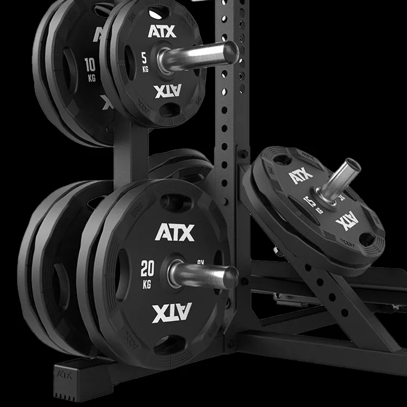 Black ATX weight plates (20 kg, 10 kg, 5 kg) are neatly stored on a metal rack with horizontal and angled pegs, set against a black background—ideal for use with your ATX® Lever Arm Squat Pro - Viking Press.