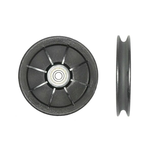 Two views of the Cable Pulley 115mm 10mmID feature a black plastic wheel with a central metal bearing. The first view displays spoke-like structures on the front, while the second view highlights its side profile, showing thickness and groove.