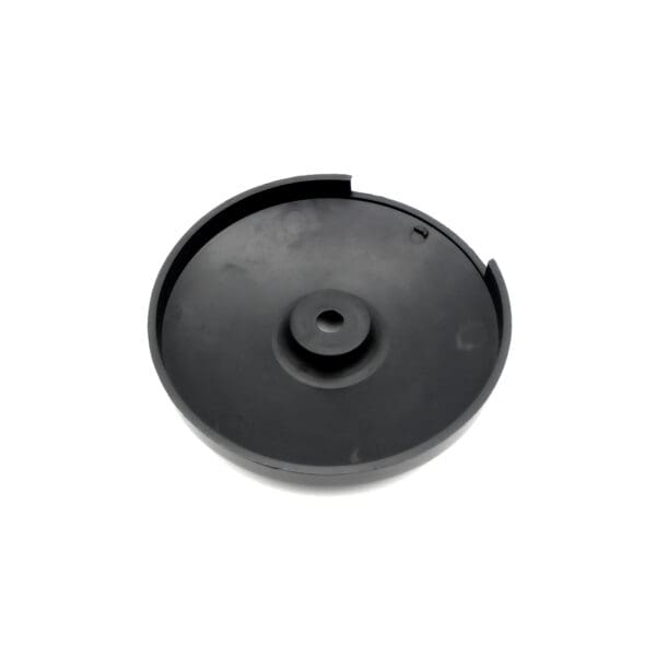 The product is the Pulley Cover 117ID, a black, round plastic item featuring a flat base, slightly raised center, and small edge notch. Its surface is smooth and plain.
